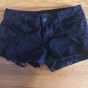 Black denim tattered jean shorts